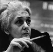 Italian MP Rossana Rossanda ponders while raising a pen in her right hand; the journalist and writer...